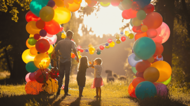 A vibrant Celebratory Balloon Arch with a joyful fami 2